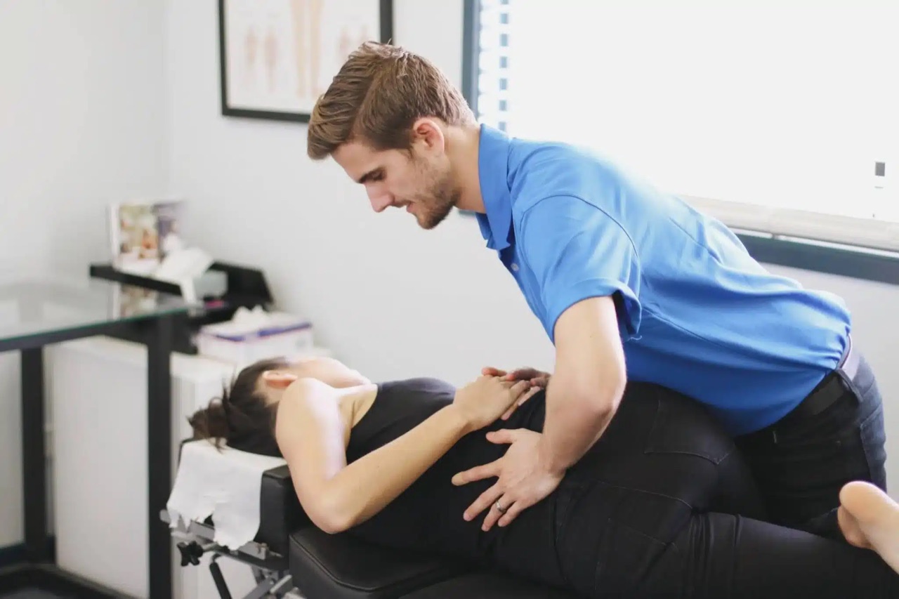 Chiropractor performing a back adjustment at Absolute Health Sunshine Coast