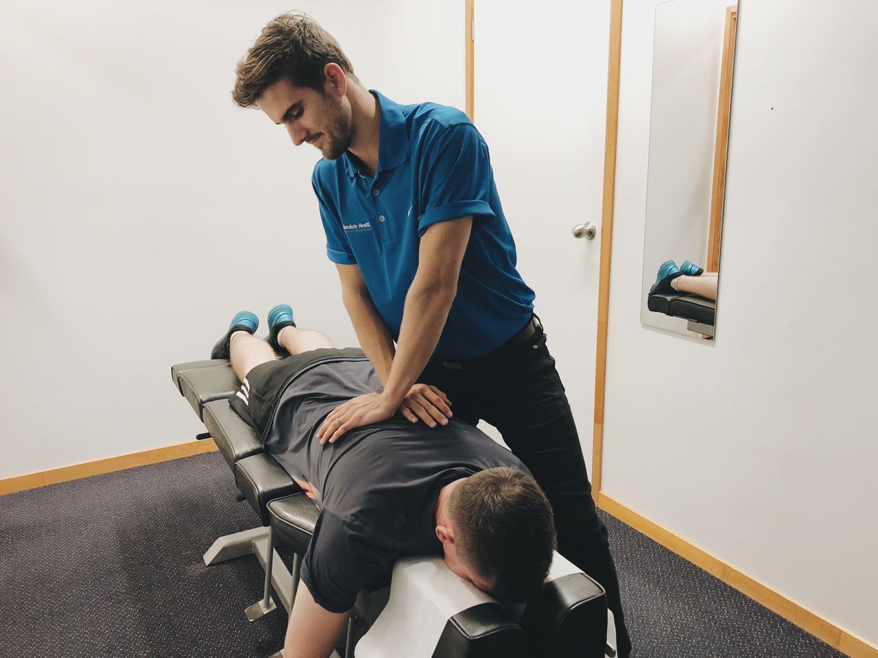 Chiropractor treating lumbar disc herniation with back pain at Absolute Health Mooloolaba
